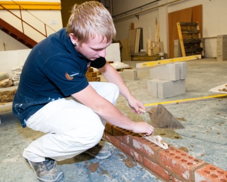 a teenager pictured at a college learning bricklaying