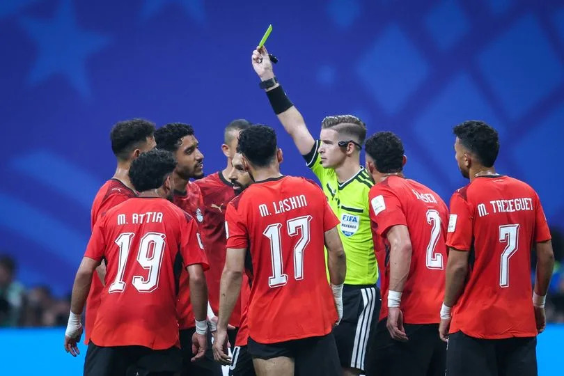 Referee Francois Letexier gives a yellow card to Hamdy Fathy of Egypt during the FIFA World Cup USA 2026 Round of 16 match between Argentina and Egypt at Atlanta Stadium in Atlanta, United States, on July 7, 2026. (Photo by Ayman Aref/NurPhoto via Getty Images)