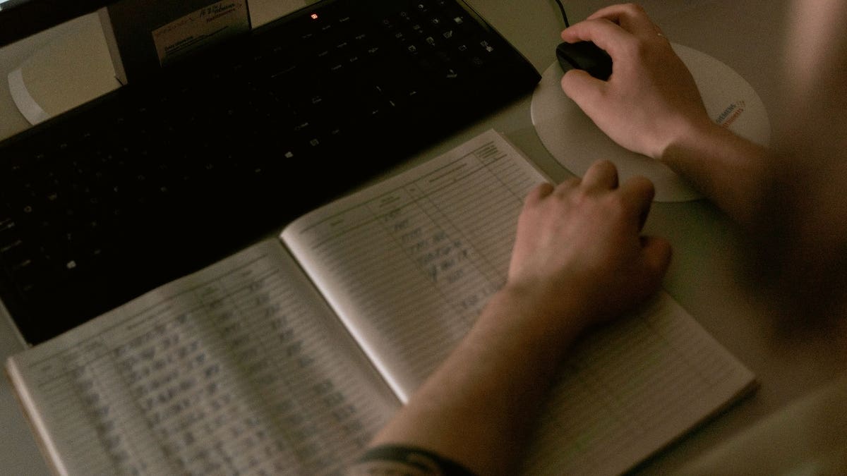 A person with a notebook